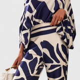 Sybella Conjunto de Dos Piezas con Hombros Descubiertos y Pantalones Amplios Estampados